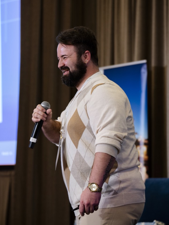 Speaker with a microphone at a company event