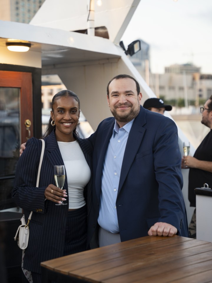 Two attendees talking at a networking evening