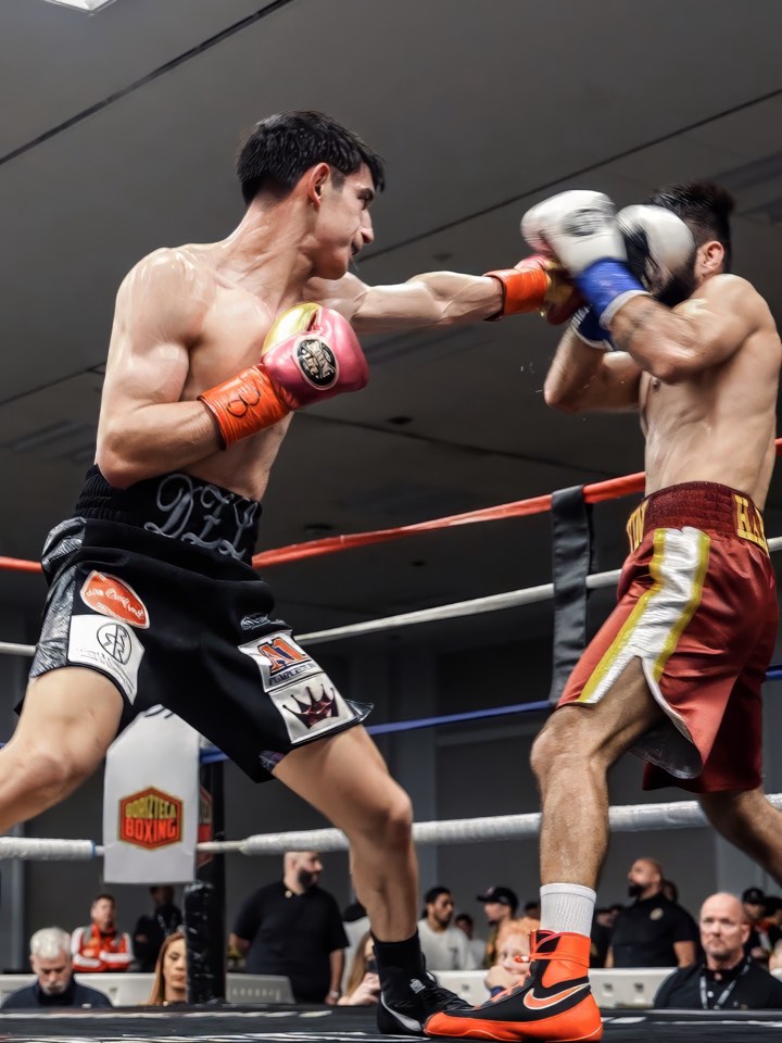 Fighter mid-round under the ring lights