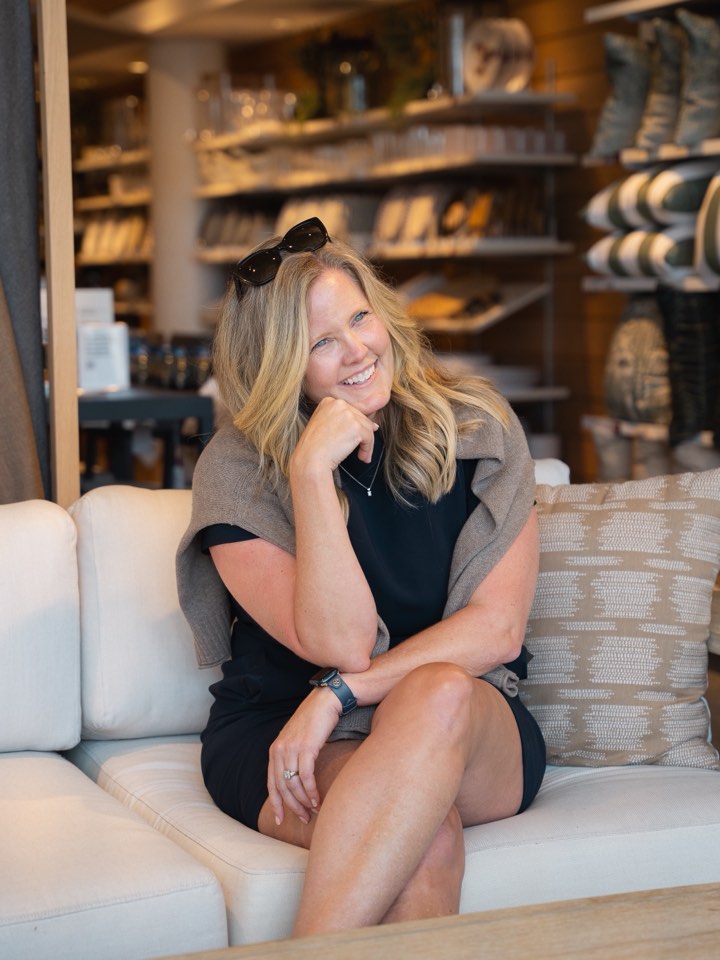 Owner seated in her retail space
