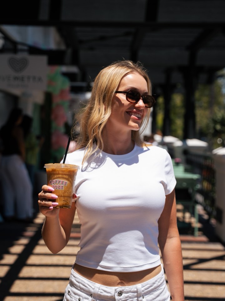 Portrait on a terrace with an iced coffee