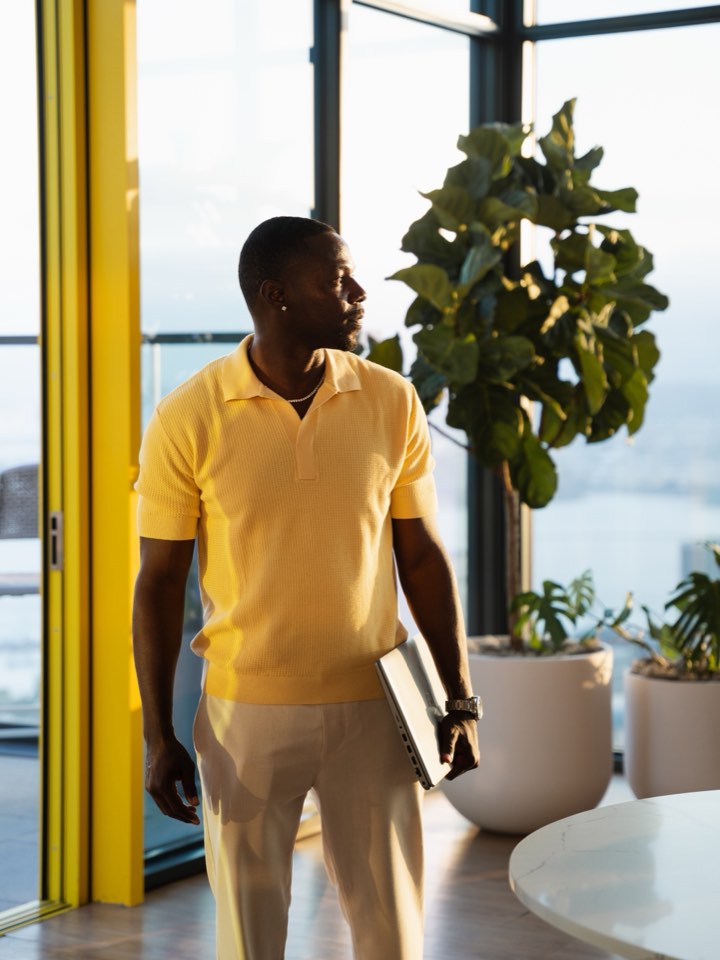 Founder walking through his office atrium