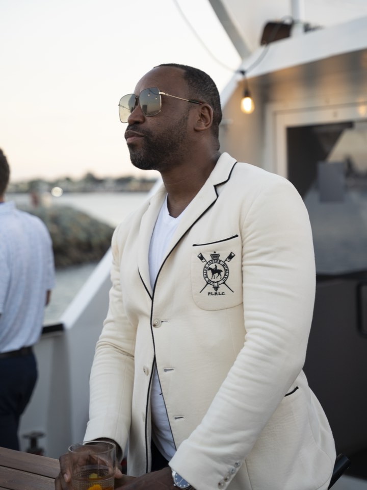 Portrait in a white blazer outside the office