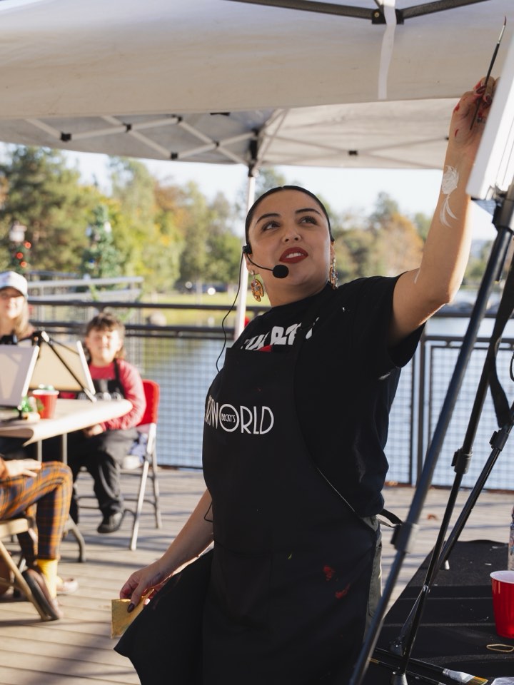 Founder setting up her booth at an outdoor event