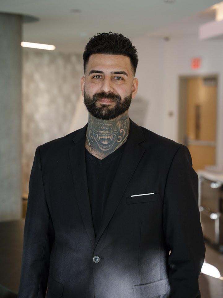 Studio portrait in a black suit