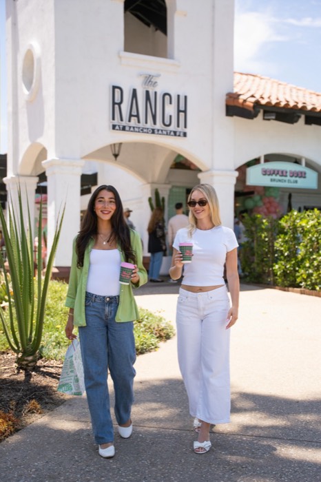 Two shoppers with coffee outside The Ranch at Rancho Santa Fe